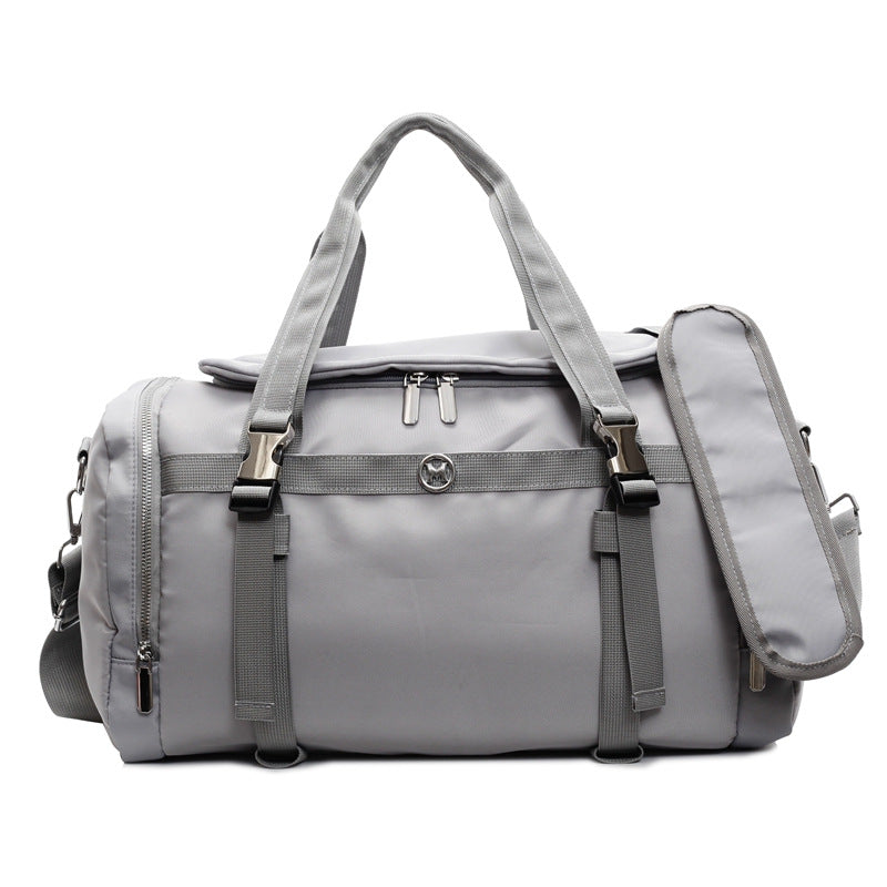 Sporty travel bag with adjustable shoulder strap and several compartments Bowlift