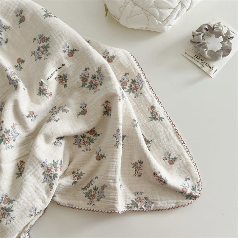 Unisex Muslin Blanket with delicate floral design and elegant ruffles Bowlift