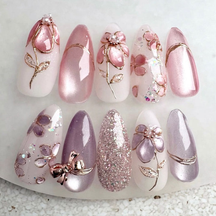 Artificial nail set with decorative flower and glitter embellishments Bowlift