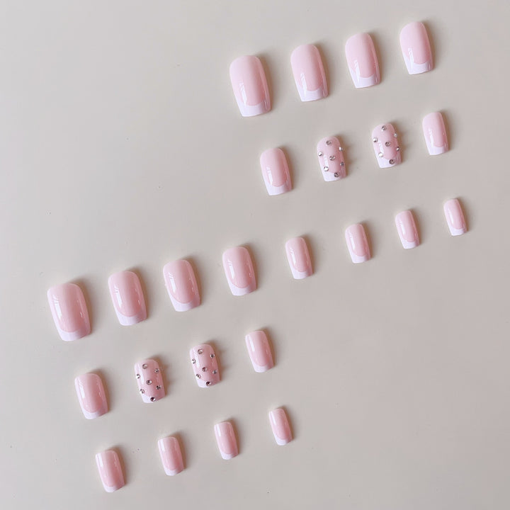 Artificial nail set with elegant rhinestones and French tip decorations Bowlift