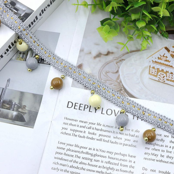 Decorative lace trim with colorful pendants Bowlift