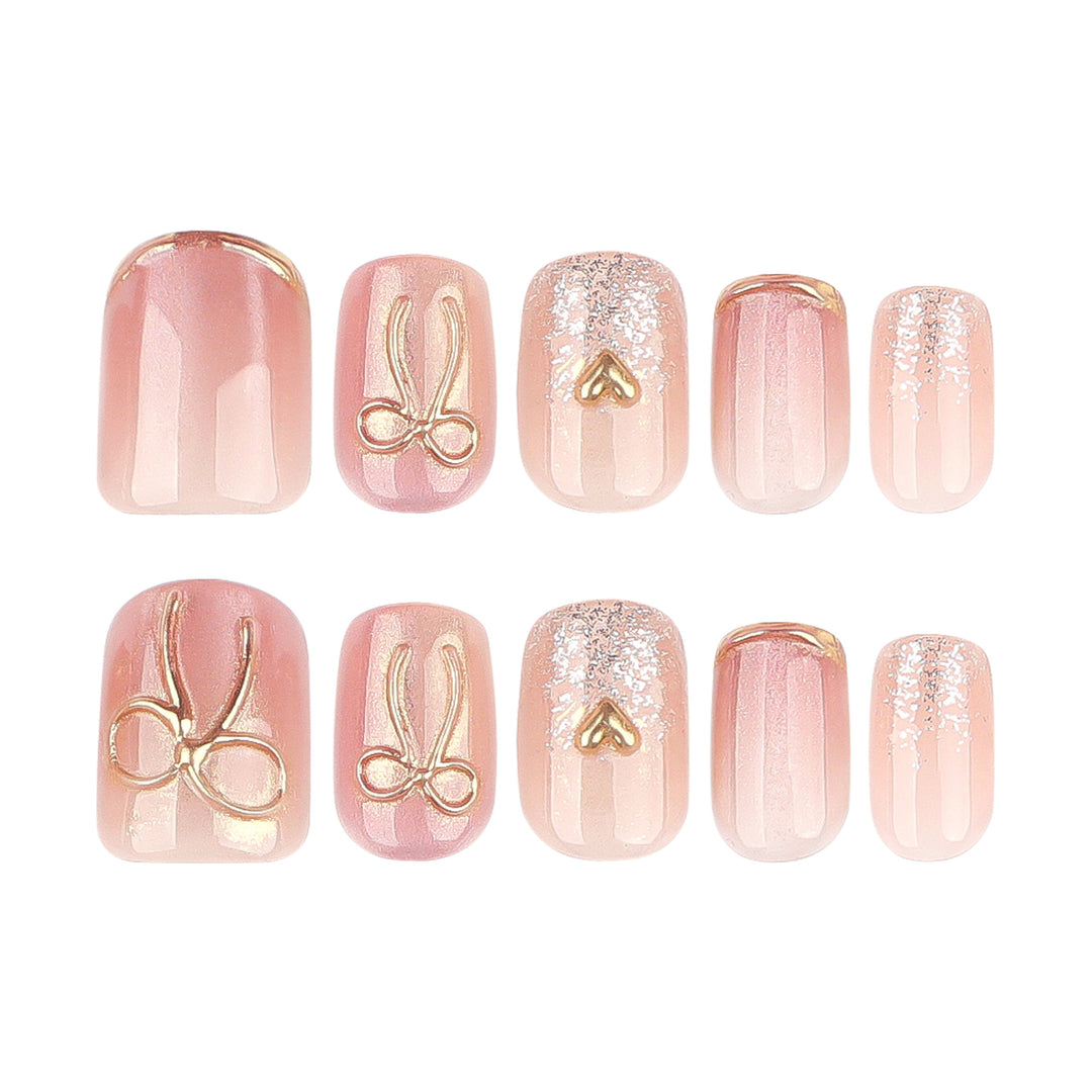 Glamorous acrylic nails with elegant gold design Bowlift