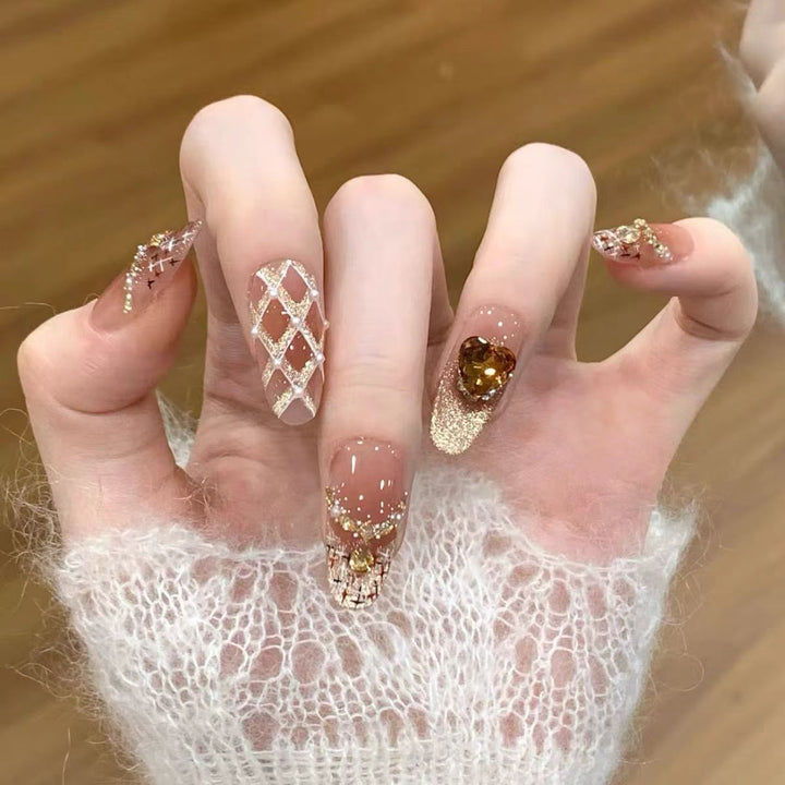 Artificial nails with glitter and heart accents Bowlift