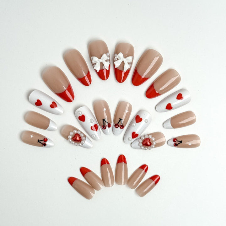 Creative nail art with heart and cherry motifs Bowlift
