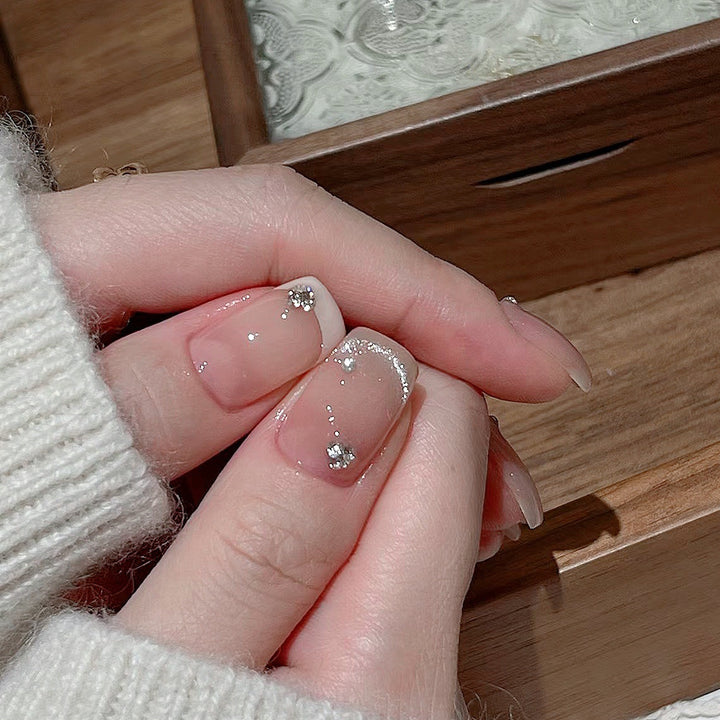 Glamorous artificial nails with filigree rhinestone details Bowlift