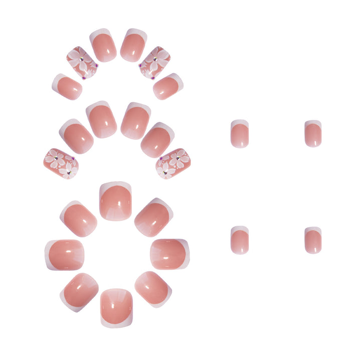 Artificial nail set with elegant French design and floral accents Bowlift