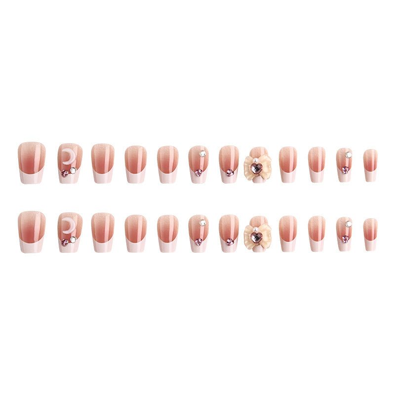 Artificial nail set with elegant floral decorations and glitter accents Bowlift