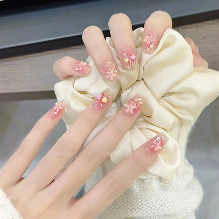 Artificial nails with floral design and glitter effects Bowlift