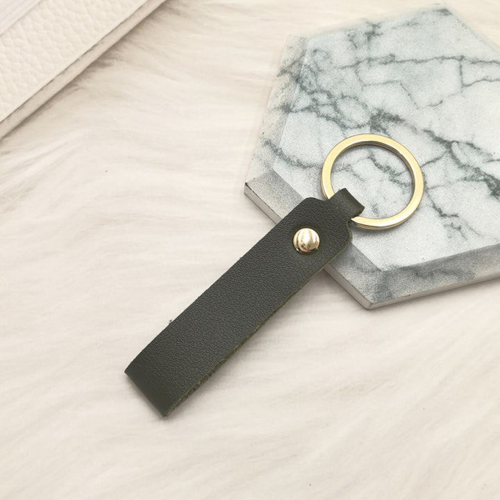 Unisex keychain made of high-quality synthetic leather with elegant metal embellishment Bowlift