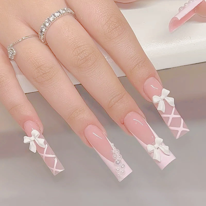 Artificial nail set with elegant 3D bows and pearl embellishments Bowlift