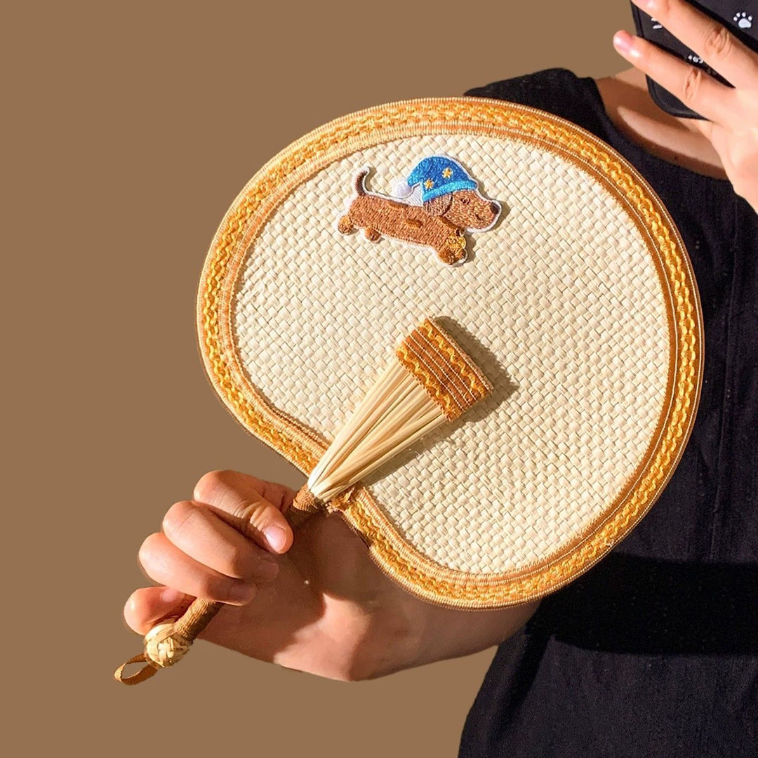 Handcrafted fan with playful dog motif Bowlift