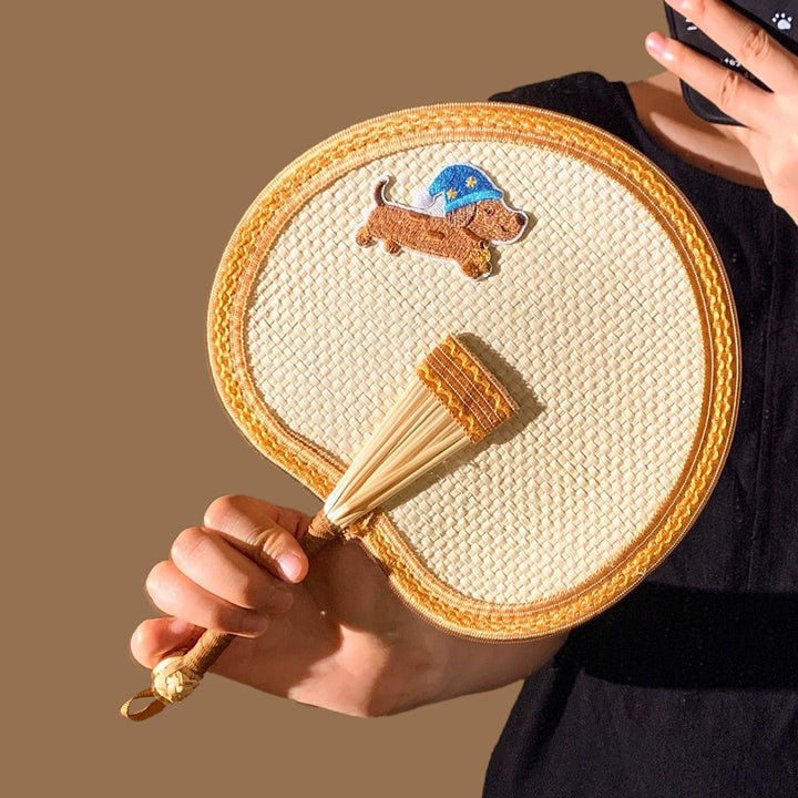Handcrafted fan with playful dog motif Bowlift
