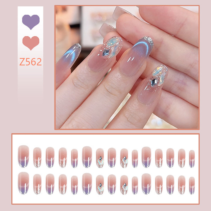 Acrylic nail set with elegant glitter effect and beautified embellishments Bowlift