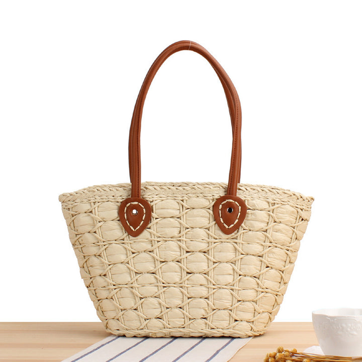 Handcrafted wicker bag with elegant leather accents Bowlift