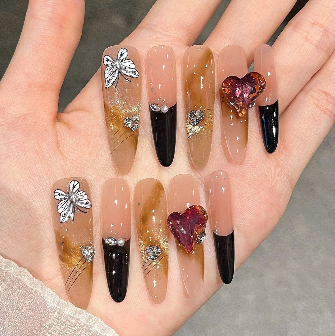 Artistic Stiletto Press-On Nail Art with Glimmering Accents Bowlift
