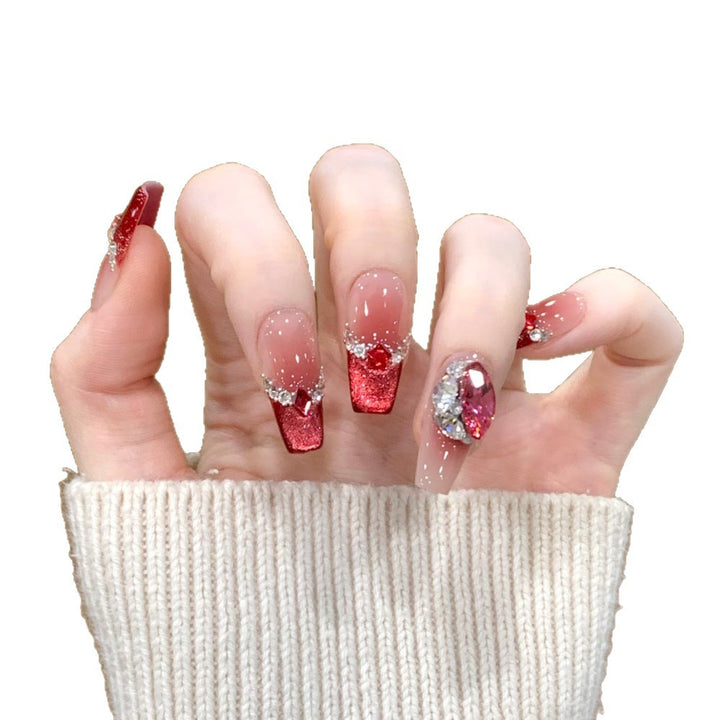 Glamorous artificial nails with sparkling rhinestone applications Bowlift