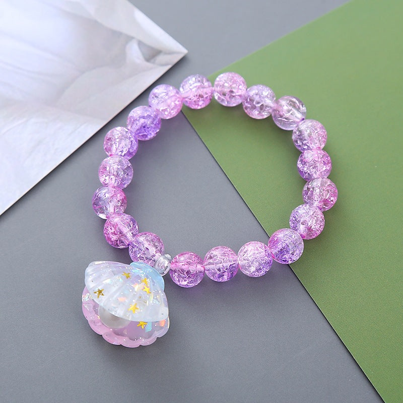 Playful bracelet with shell pendant Bowlift