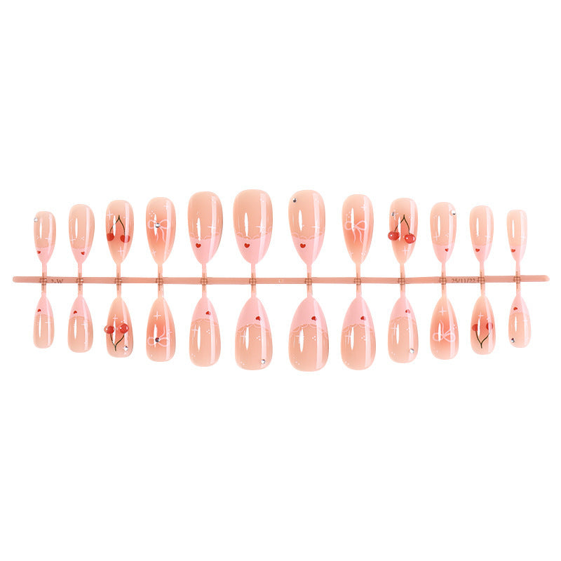 Artifical nails with playful heart and bow designs Bowlift