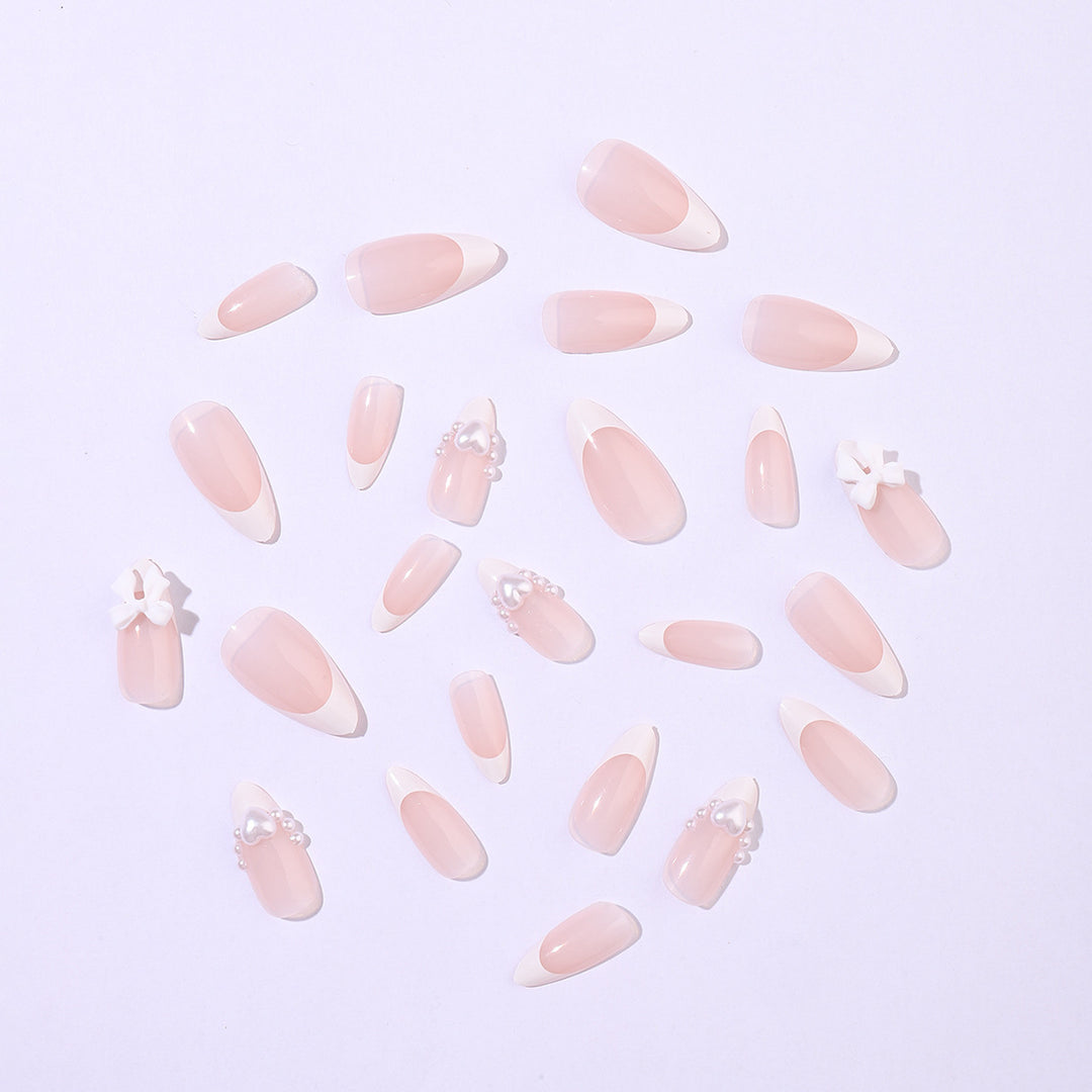 Artificial nail set with elegant pearl and bow decorations Bowlift