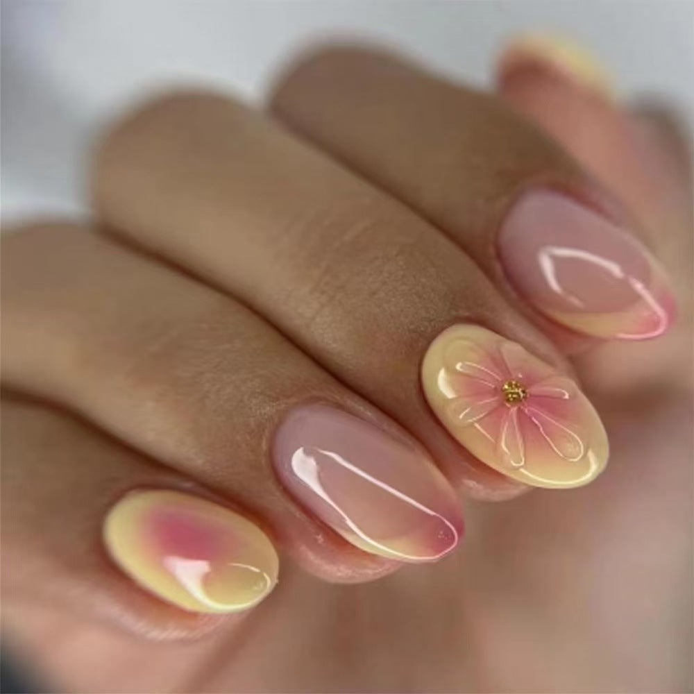 Artistic Almond-Shaped Press-On Nails with Floral Accents Bowlift