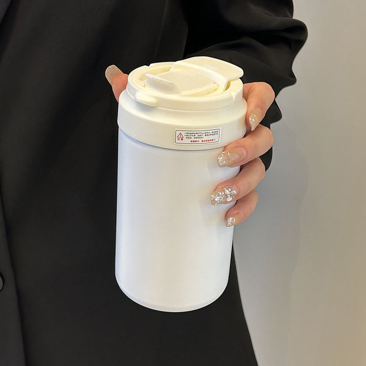 Women's insulated mug with practical spill protection and comfortable carrying handle Bowlift