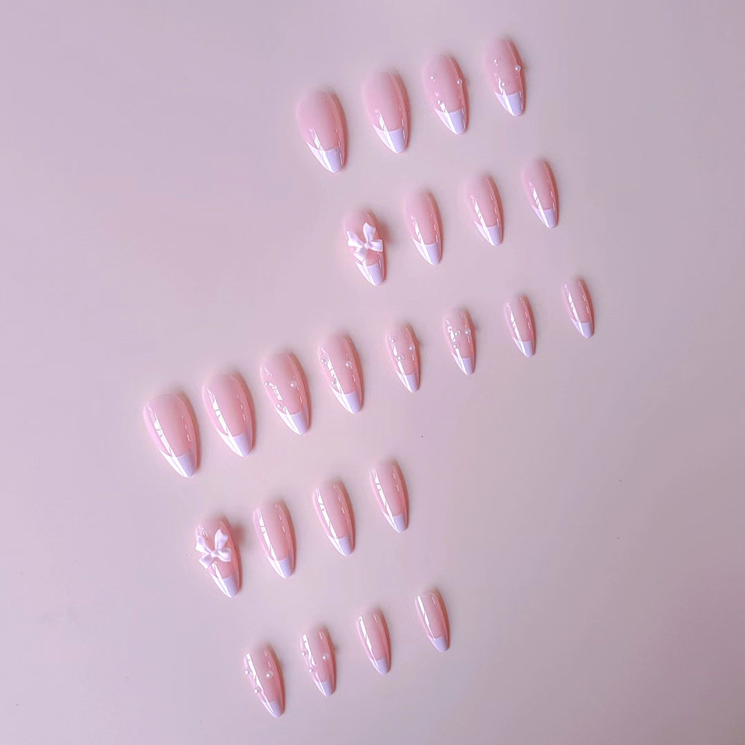 Artificial nail set with shimmering 3D bows and elegant pearl accents Bowlift