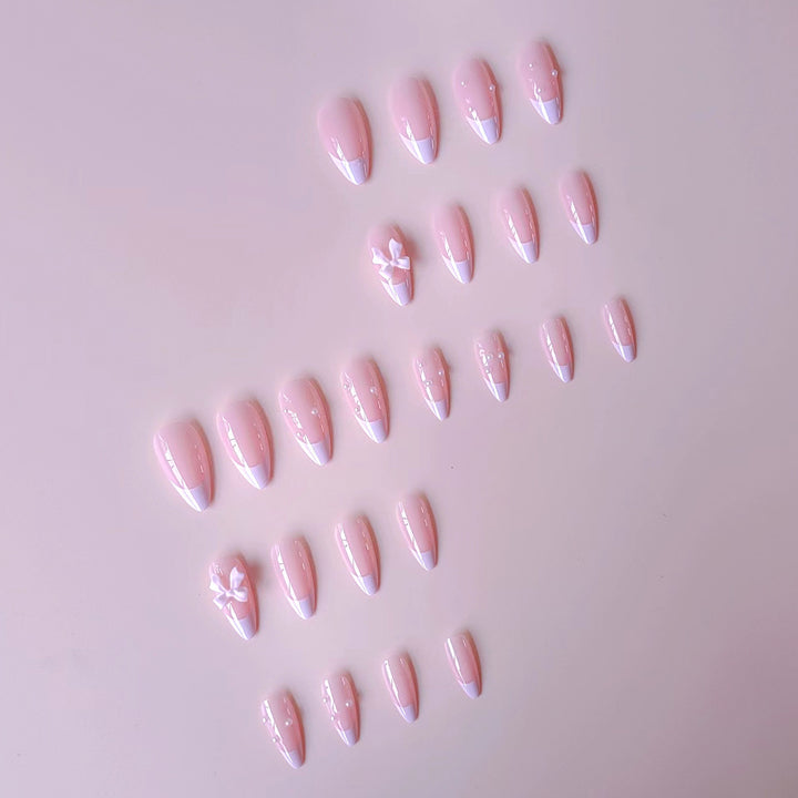 Artificial nail set with shimmering 3D bows and elegant pearl accents Bowlift