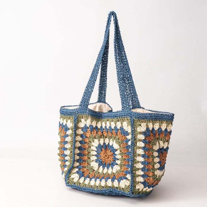 Beach bag made of hand-woven natural material with a square pattern Bowlift