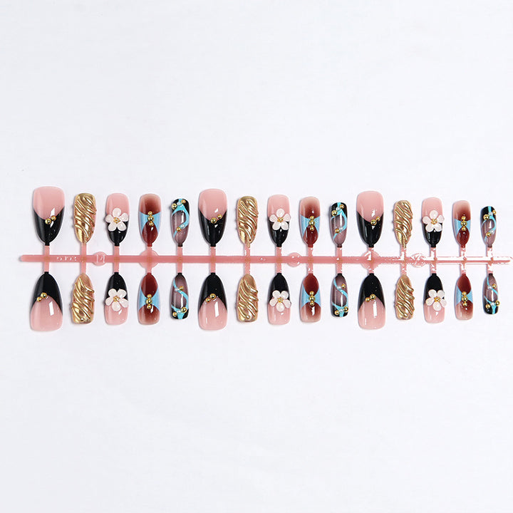 Artificial nail set with filigree floral decorations and glamorous accents Bowlift