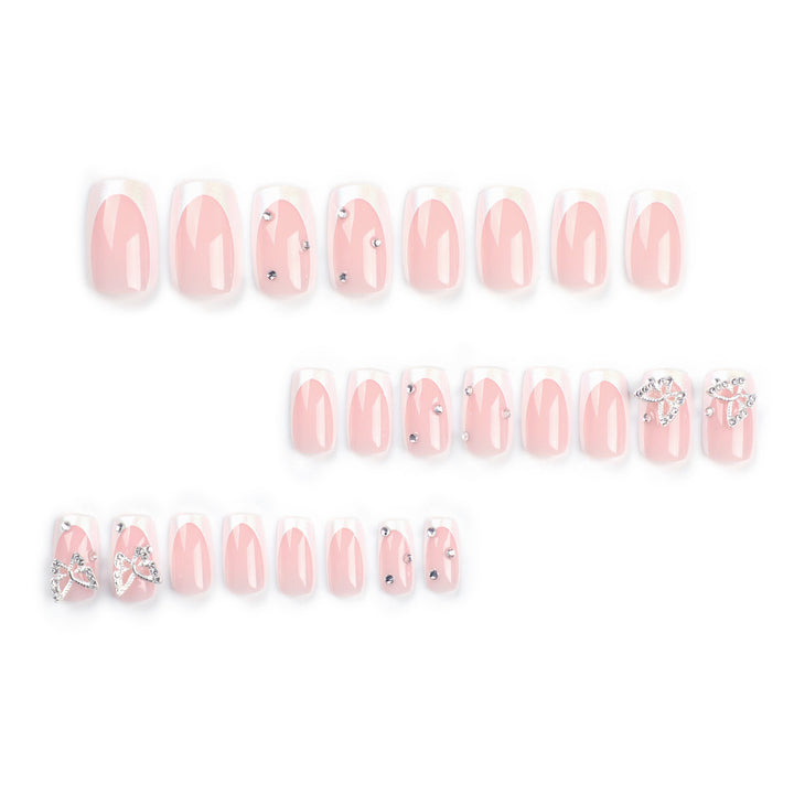 Elegant Nail Art with Glitter and Floral Accents Bowlift