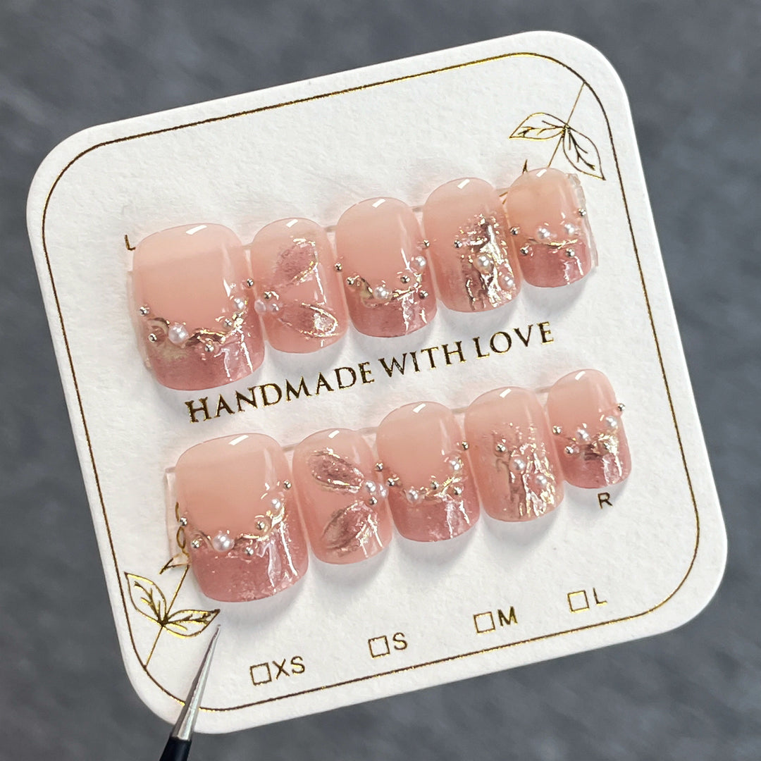 Handmade art nails with delicate embellishments Bowlift
