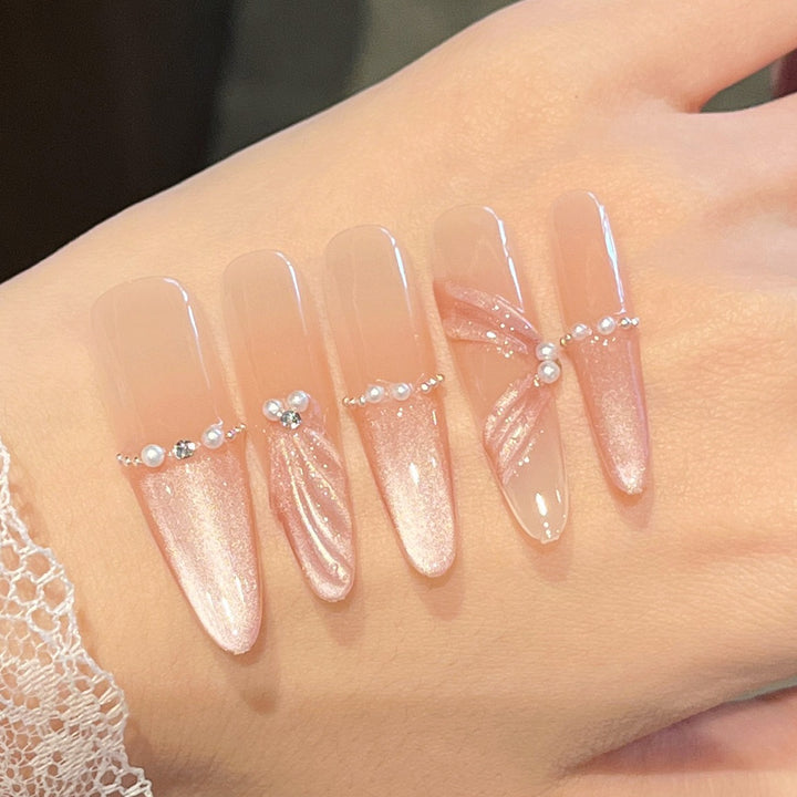 Artistic Stiletto Press-On Nail Art with Glimmering Accents Bowlift