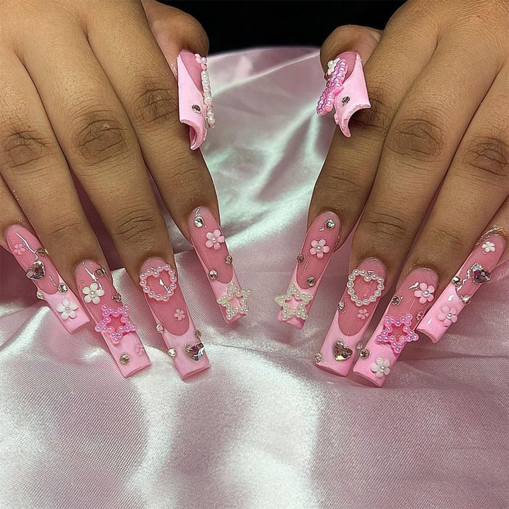 Creative acrylic nail set with delicate pearl and gloss accents Bowlift