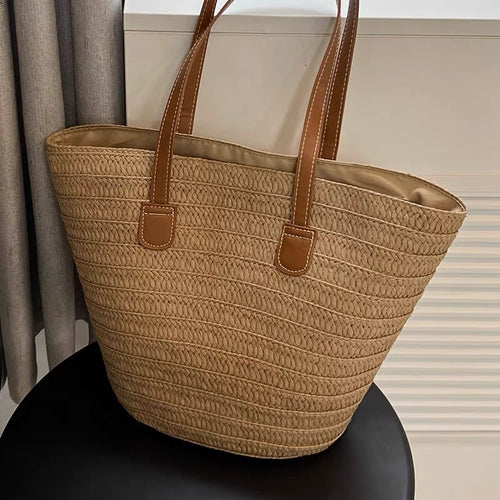 Stylish beach bag made of woven natural material with leather handles Bowlift