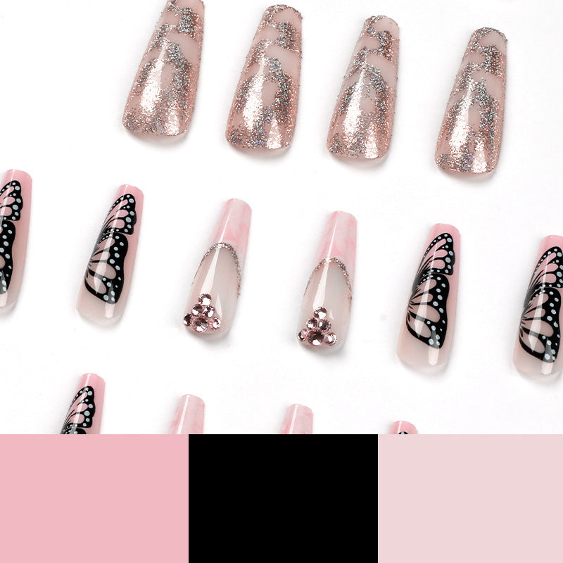 Glamorous nail extensions with beautiful butterfly motifs and glitter accents Bowlift