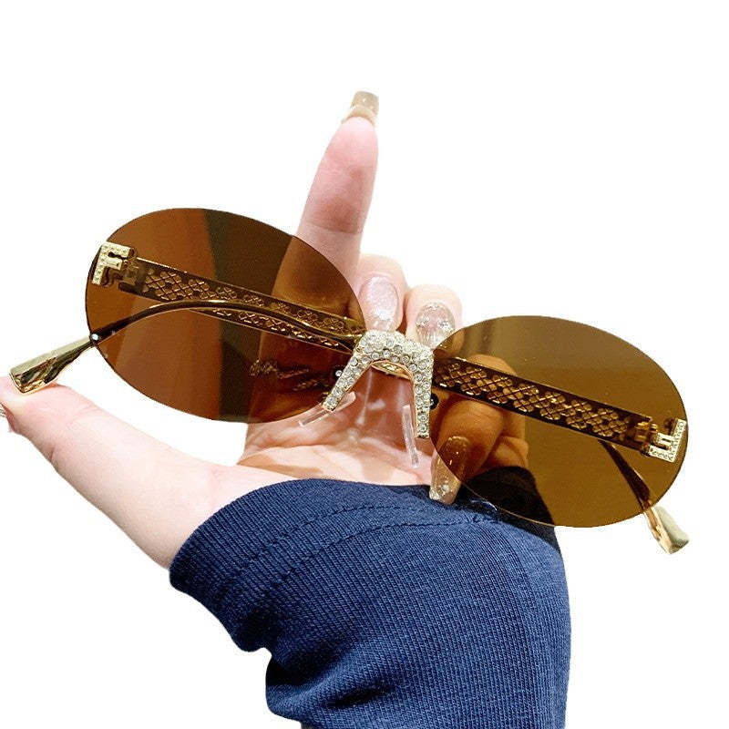 Women's sunglasses with glittering frame and oval lenses Bowlift