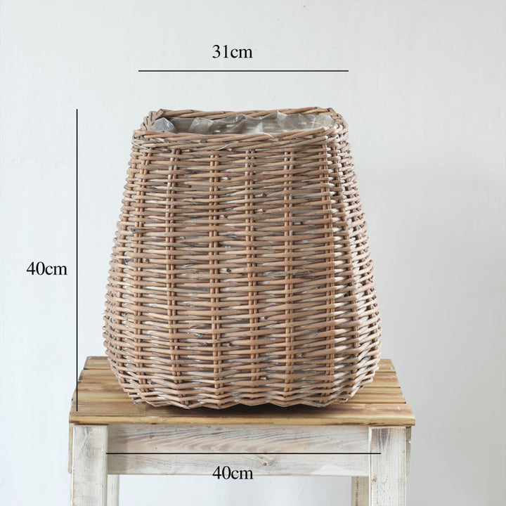 Stylish laundry basket made of braided natural material Bowlift