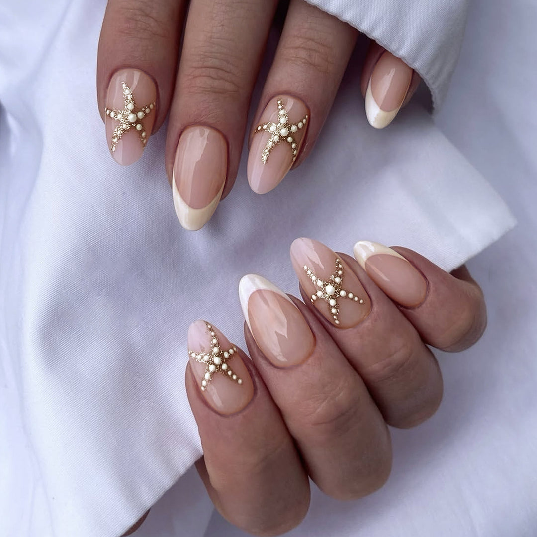Artificial nail set with delicate pearlescent and glitter accents Bowlift