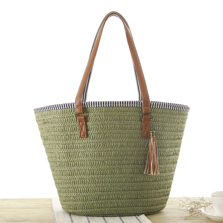 Beach bag made of hand-woven natural material with elegant leather accent Bowlift