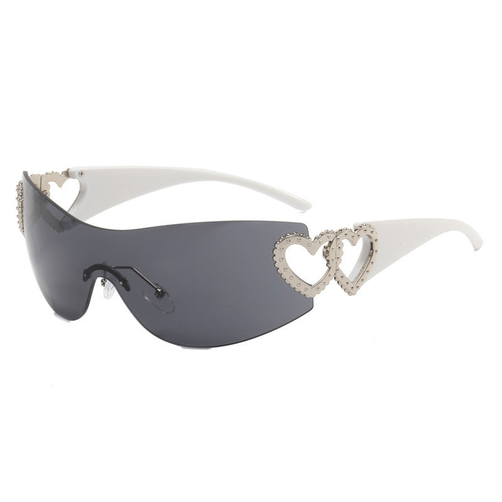 Ladies sporty sunglasses in trendy shield design with heart accents Bowlift