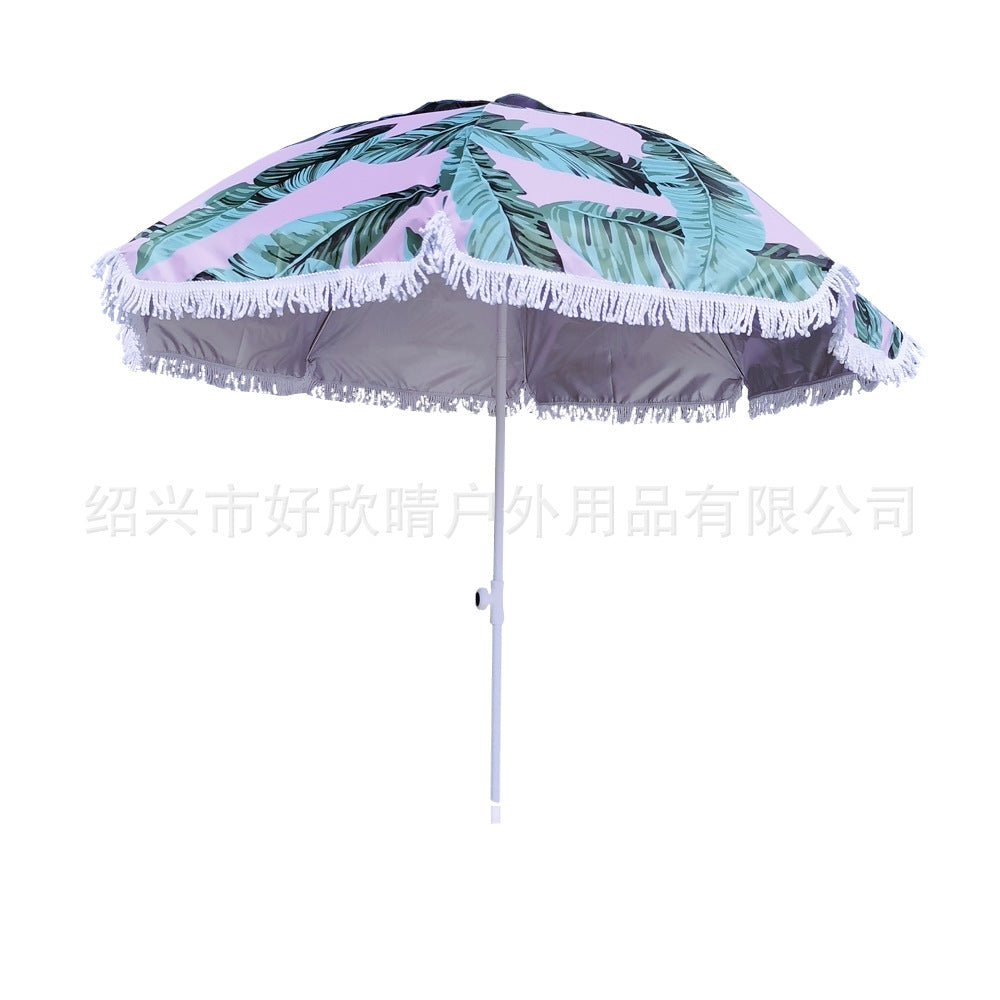 Ladies sun umbrella with tropical leaf design and tassel decoration Bowlift