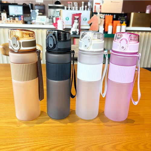 Ladies practical and leak-proof drinking bottle with integrated carrying strap Bowlift