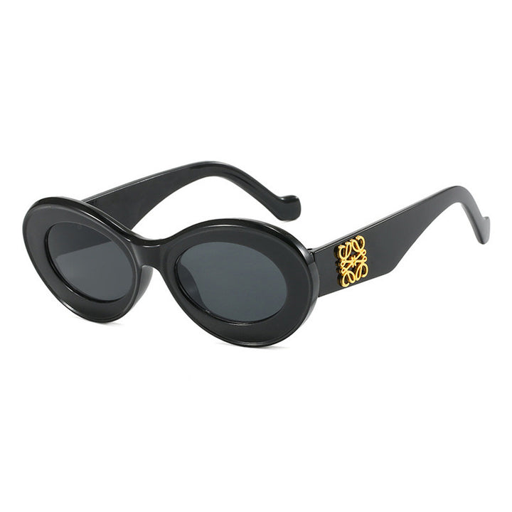 Women's fashionable sunglasses with oval frame and golden accents Bowlift