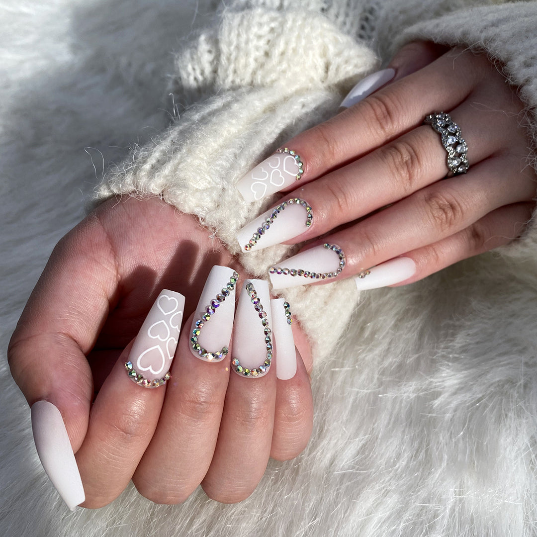 Artful Nail Extensions with Heart Design and Glitter Accents Bowlift
