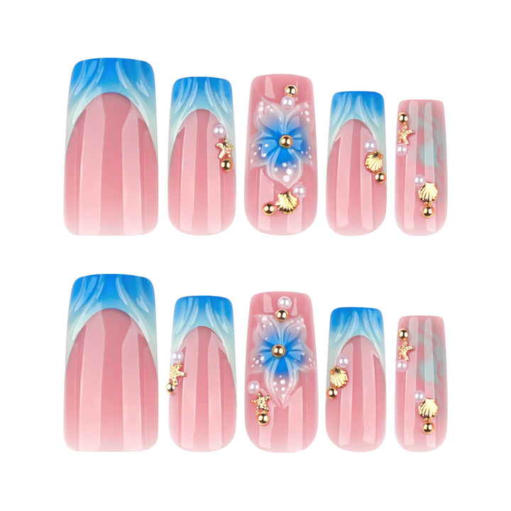 Artful nail art with floral accents and glitter effects Bowlift
