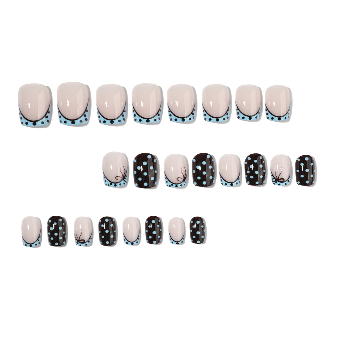 Artful nail extensions with playful dots and elegant design Bowlift