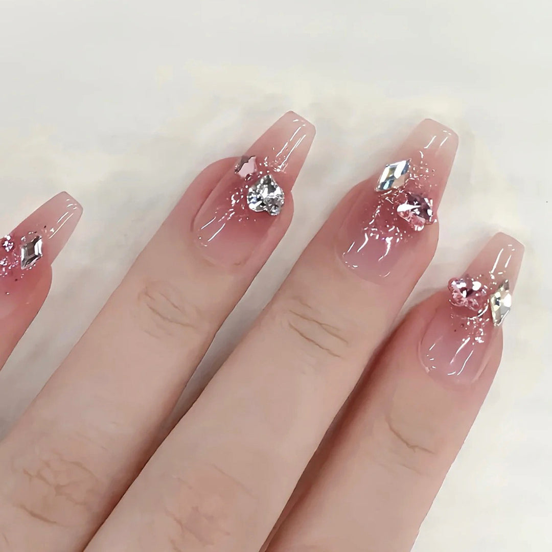 Glamorous artificial nails with glitter and crystal embellishment Bowlift