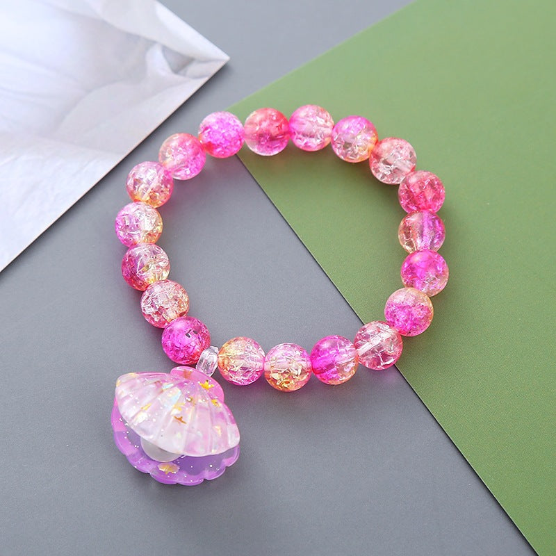Playful bracelet with shell pendant Bowlift