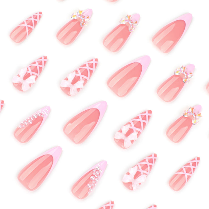 Artful stiletto nails with glitter and bow decoration Bowlift