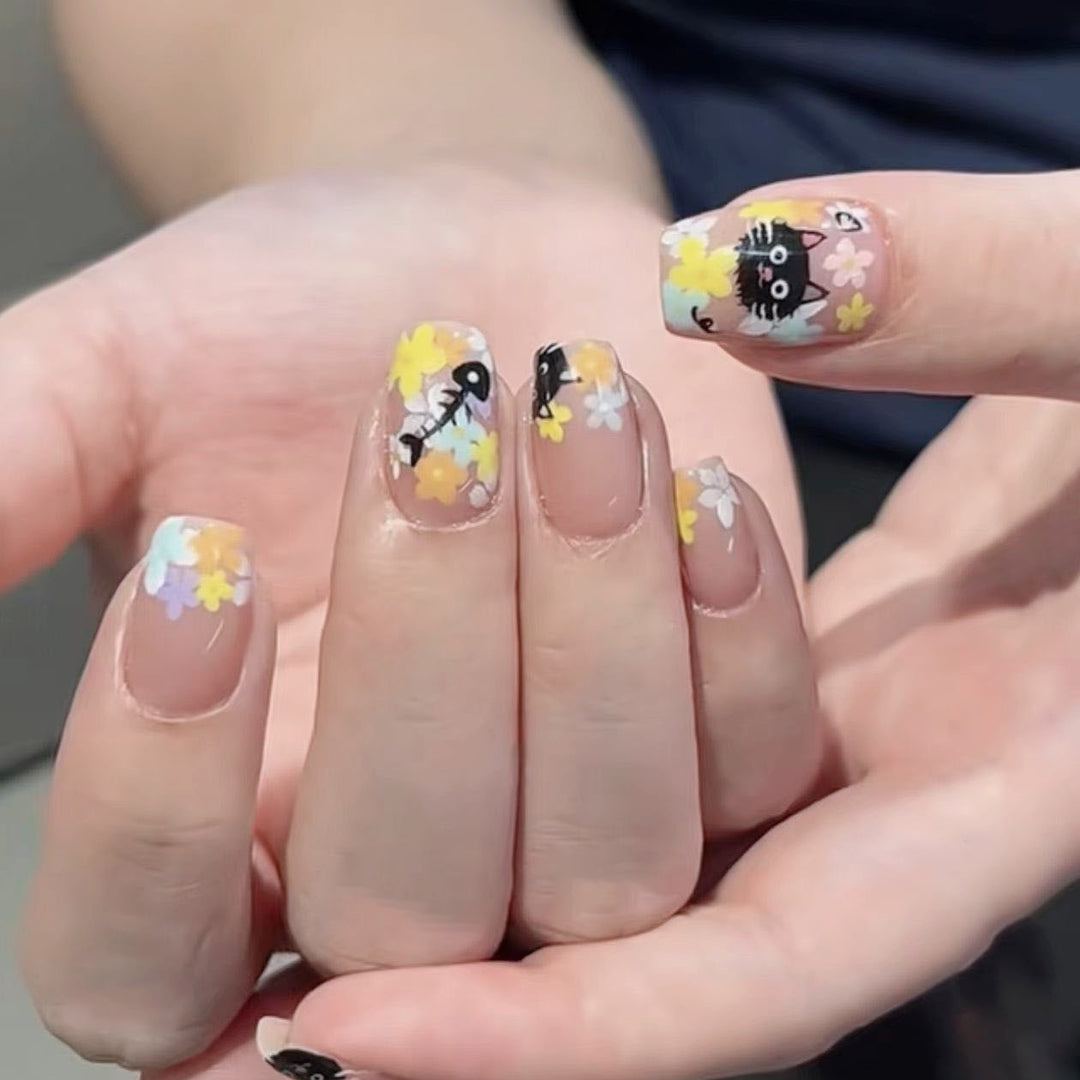Decorative Long Stiletto Press-On Nails with Heart and Floral Accents Bowlift